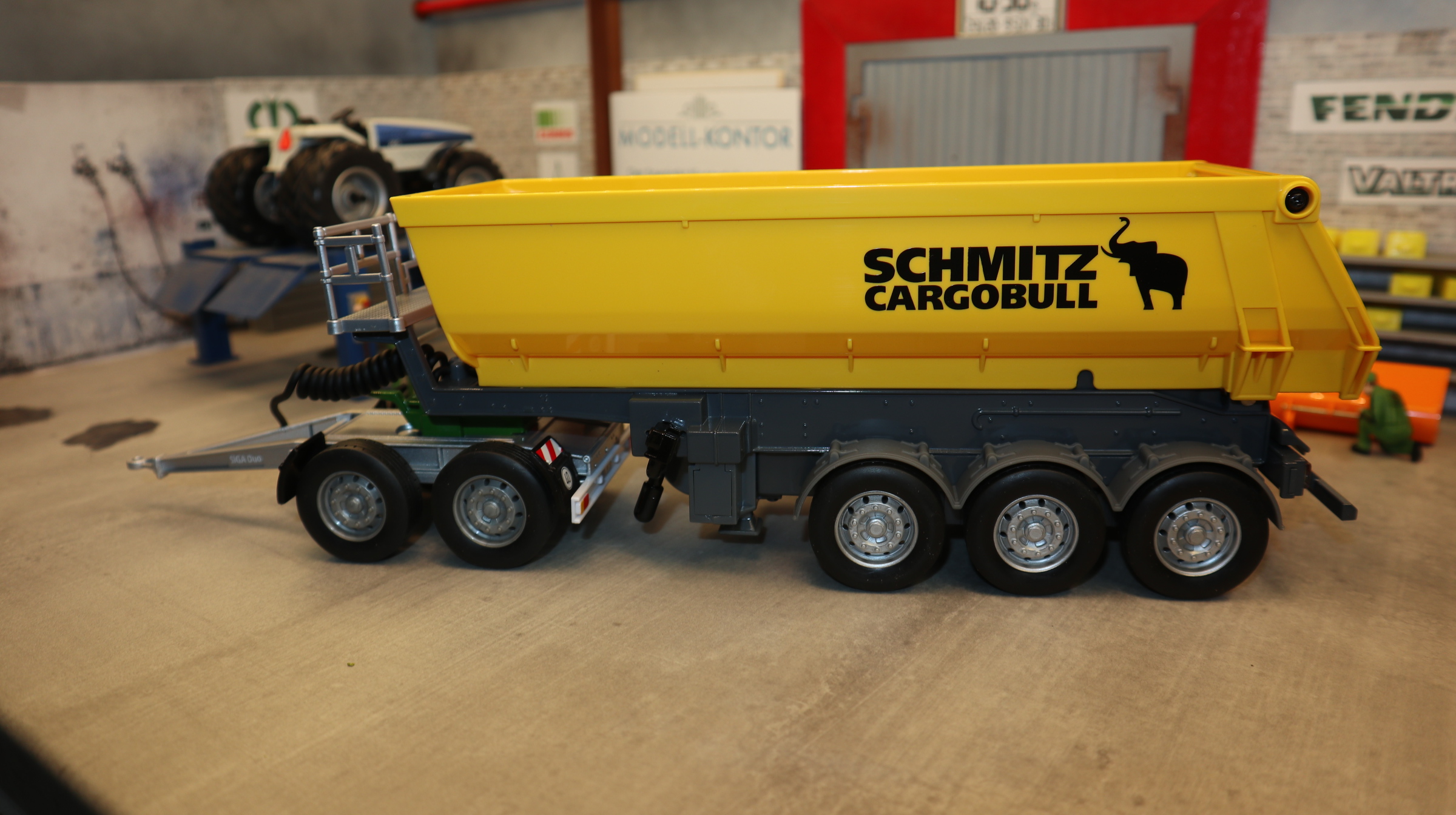 Siku 6734 + 2887 als Set in 1:32,  Kipper gelb Control mit SIGA Dolly silber-grün NEU in OVP